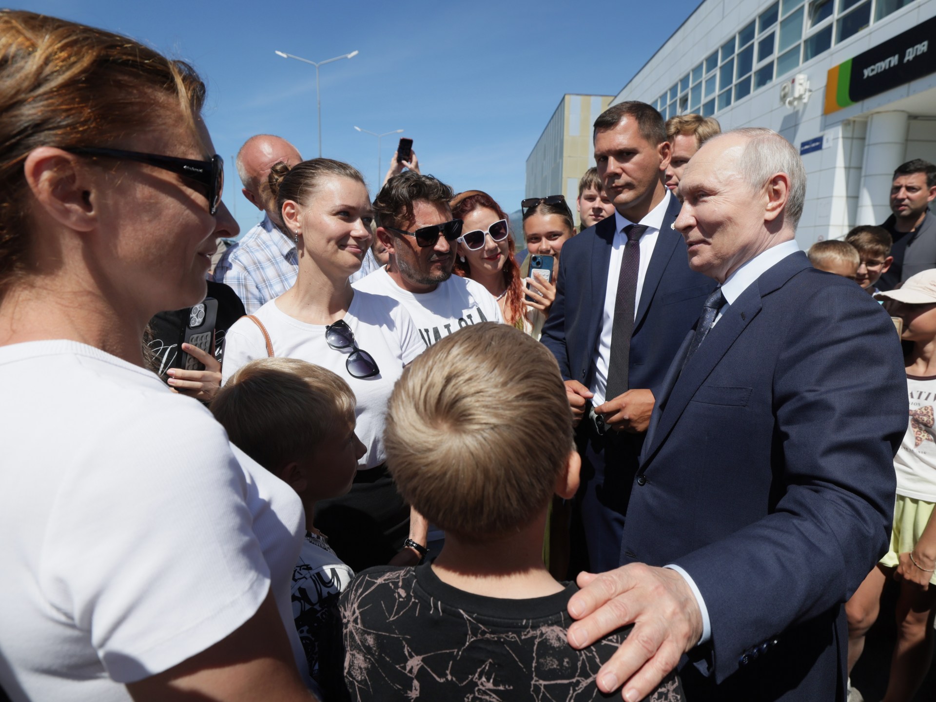 Putin visits disputed islands, Japan protests